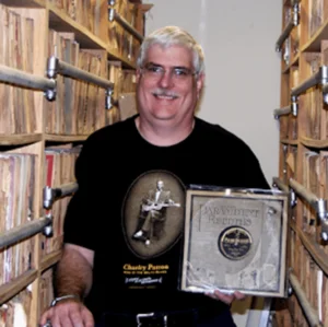 Naysayers: photo of John Tefteller surrounded by his record collection